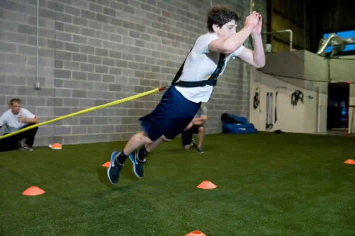 image of man doing cross athletic training on synthetic turf