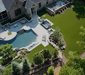 Aerial view of a backyard pool and landscaped lawn with artificial turf